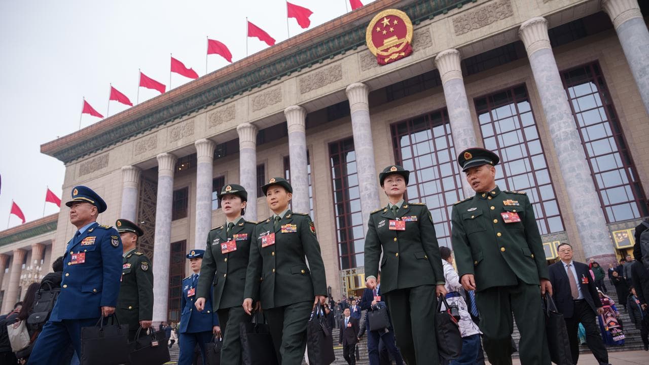 Delegates leave after the National People's Congress