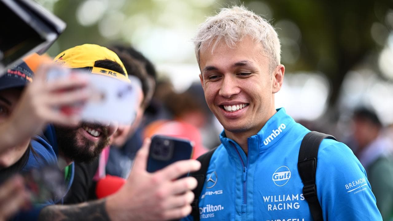 Alex Albon of Williams greets fans