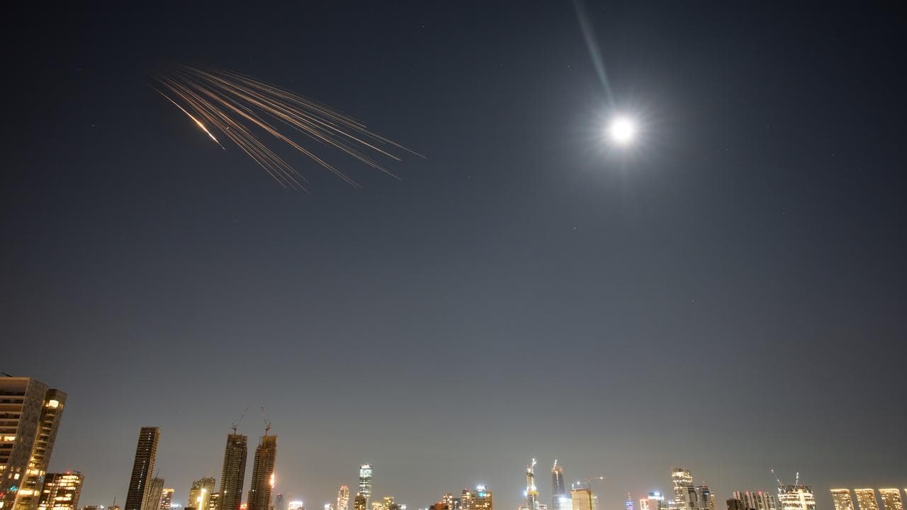 Missiles launched from Iran are seen in the sky over central Israel