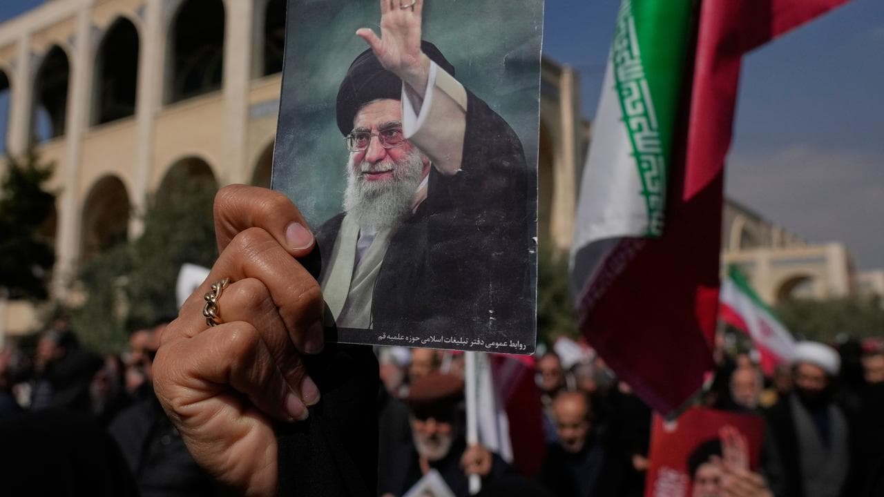 A supporter holds a pictures Iranian supreme leader Ali Khamenei