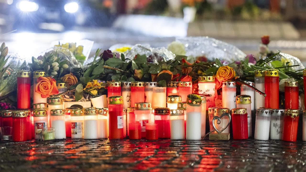 Flowers and candles at the site