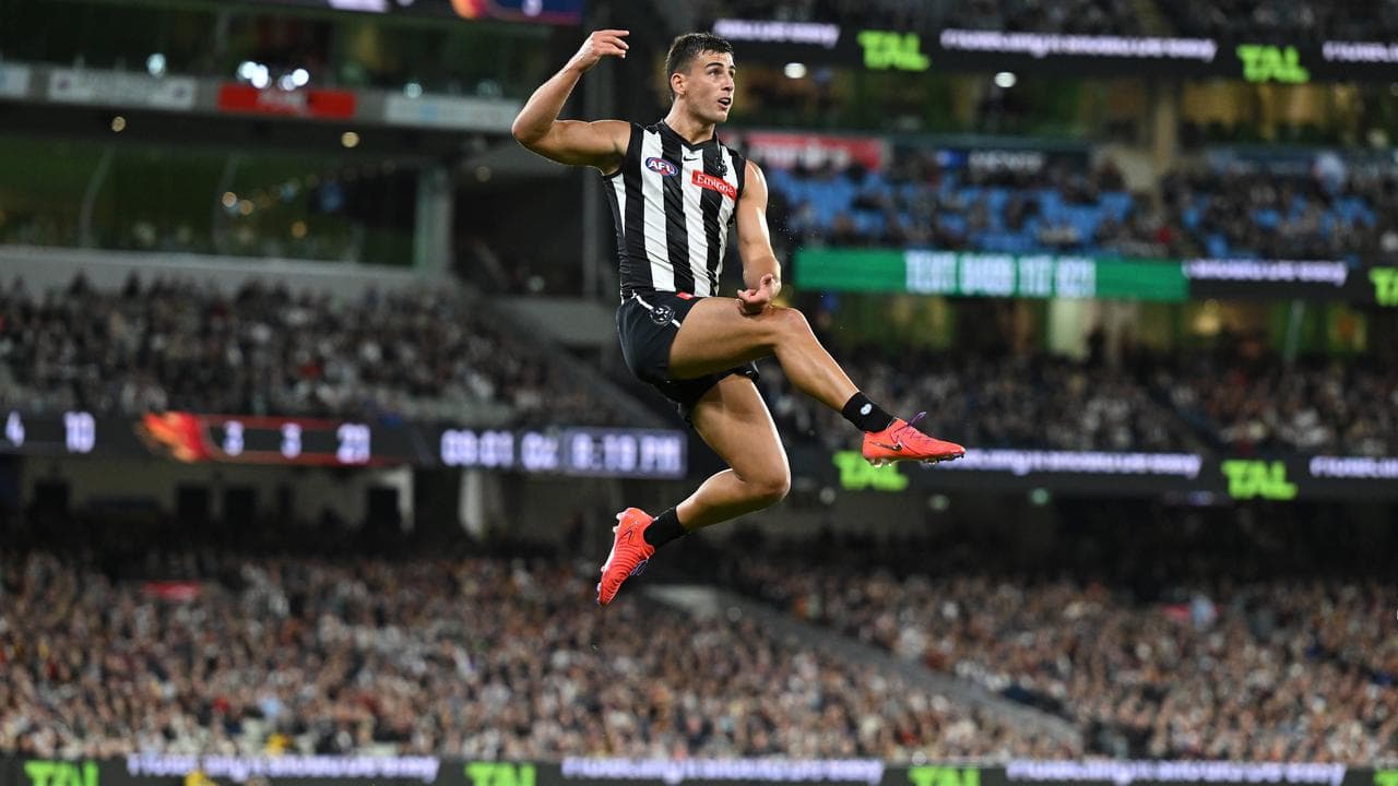 Nick Daicos of Collingwood kicks the footy
