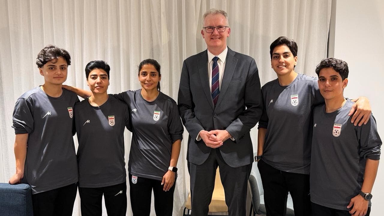Tony Burke with Iranian soccer players