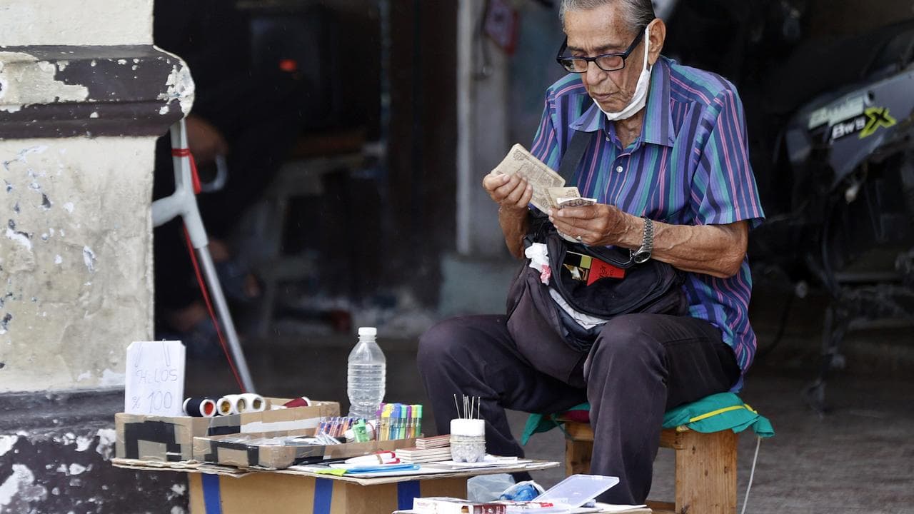 A man counts banknotes in Havana