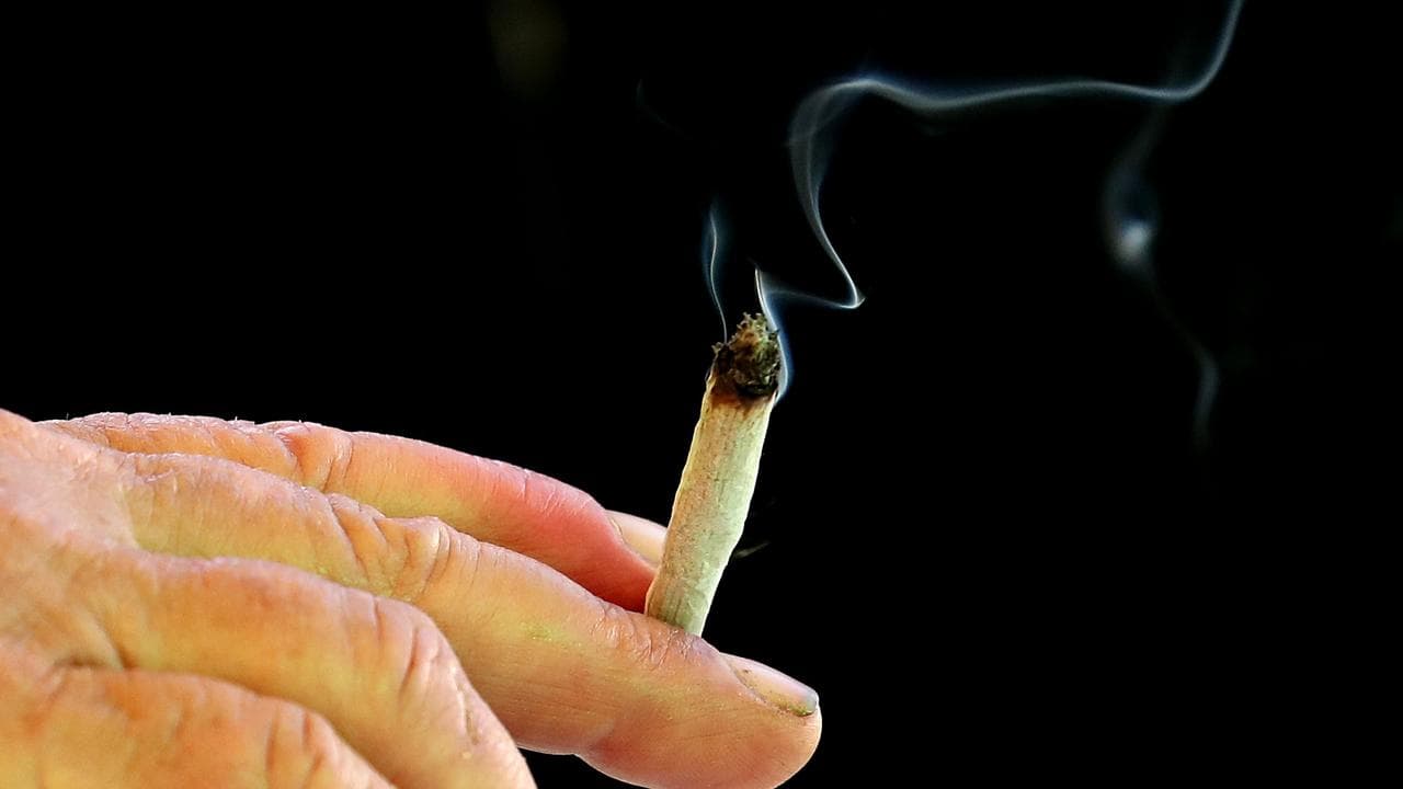 A person smokes cannabis