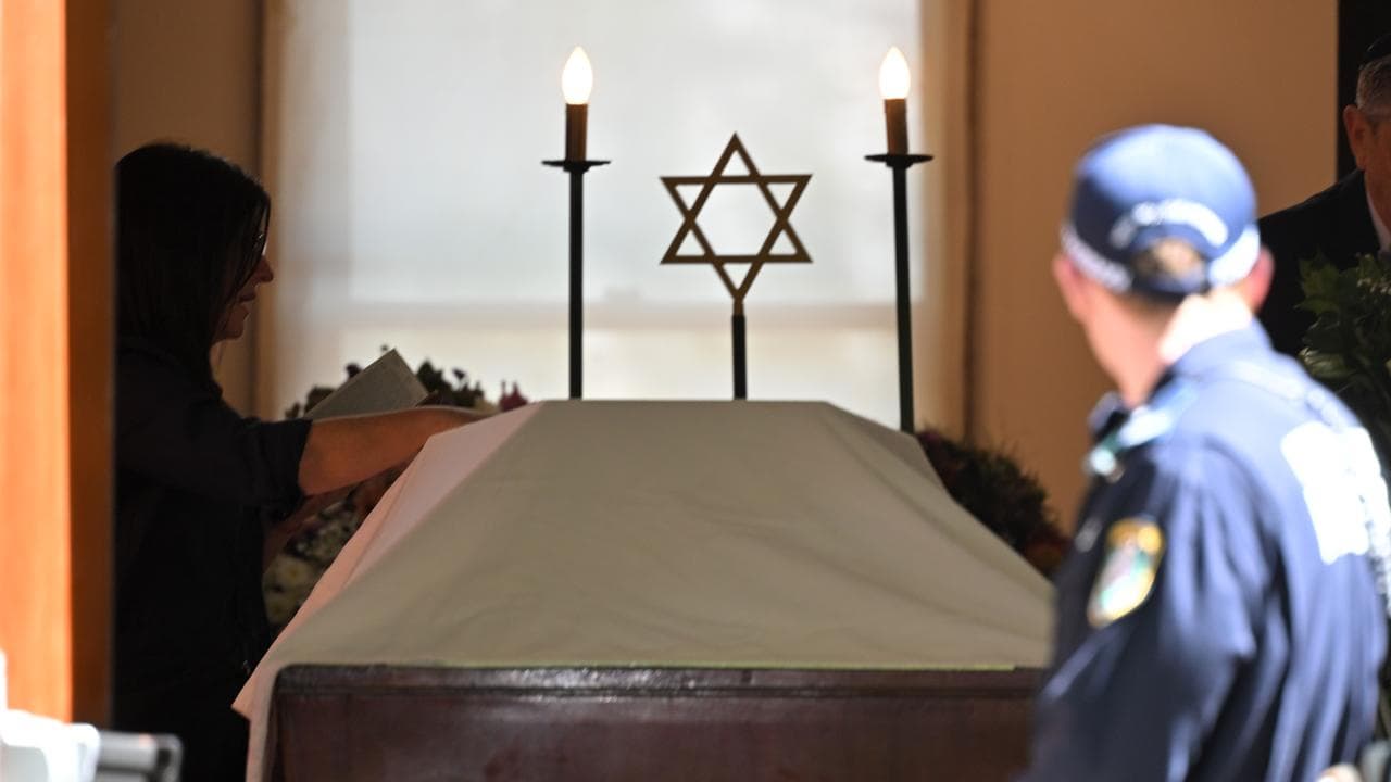 A policeman stands guard before a casket (file image)