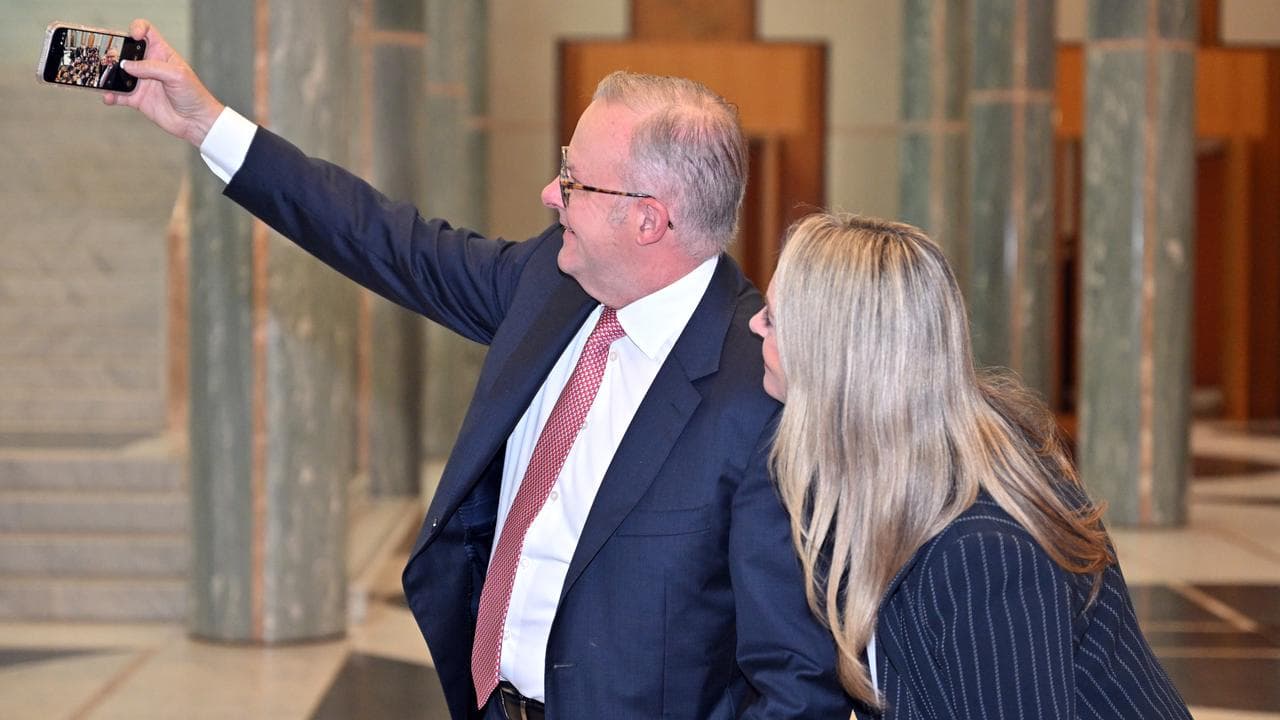 A photo of Anthony Albanese taking a photo with his wife Jodie Haydon.
