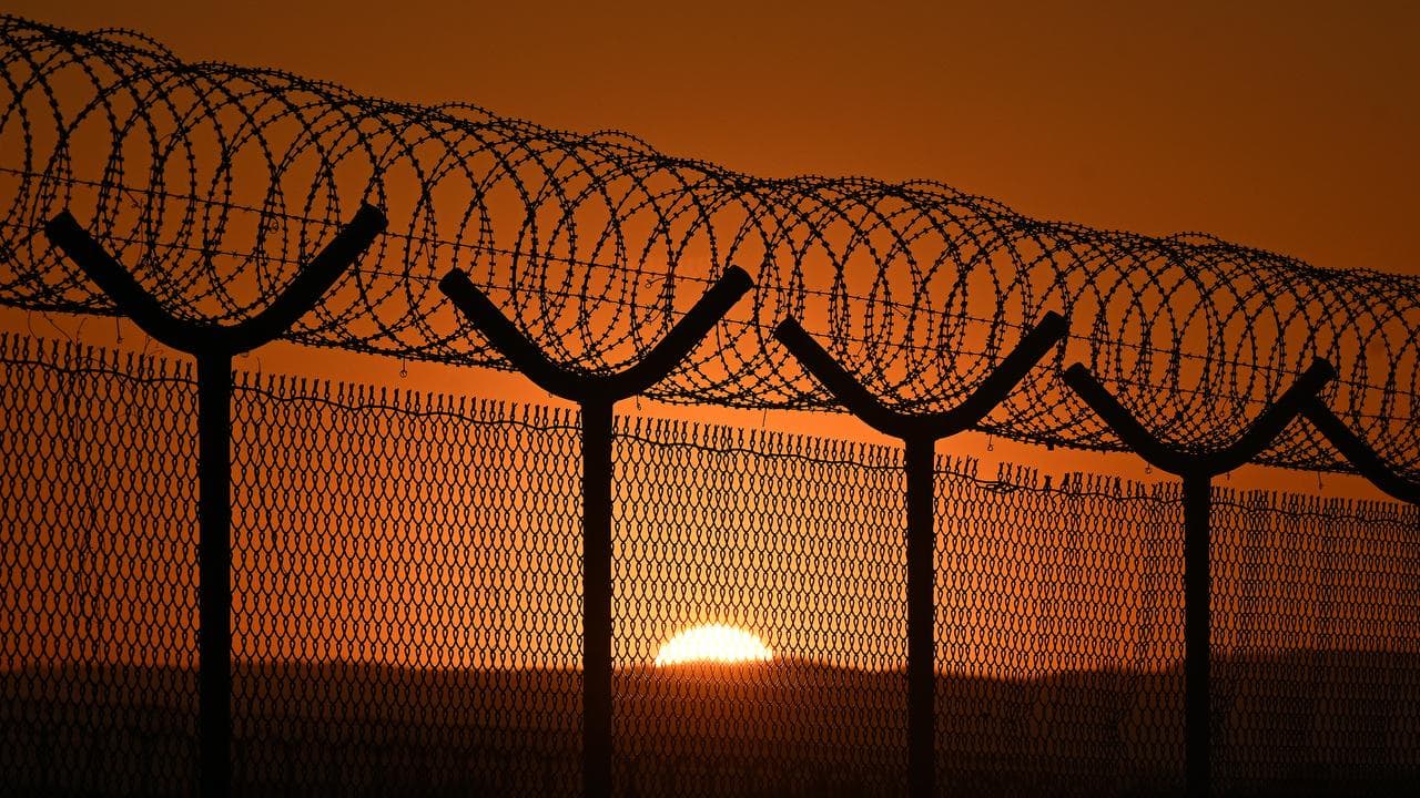 Barbed wire security fencing is seen at Brisbane Airport,