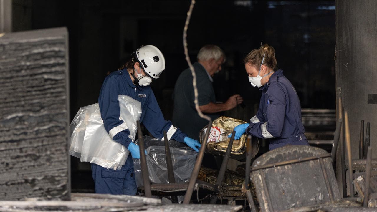 Forensic police at a shop fire (file image)