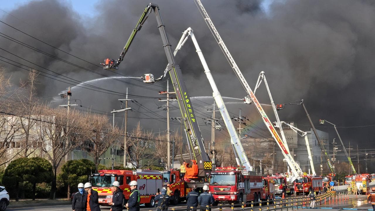 Black smoke rises from an auto parts plant in Daejeon