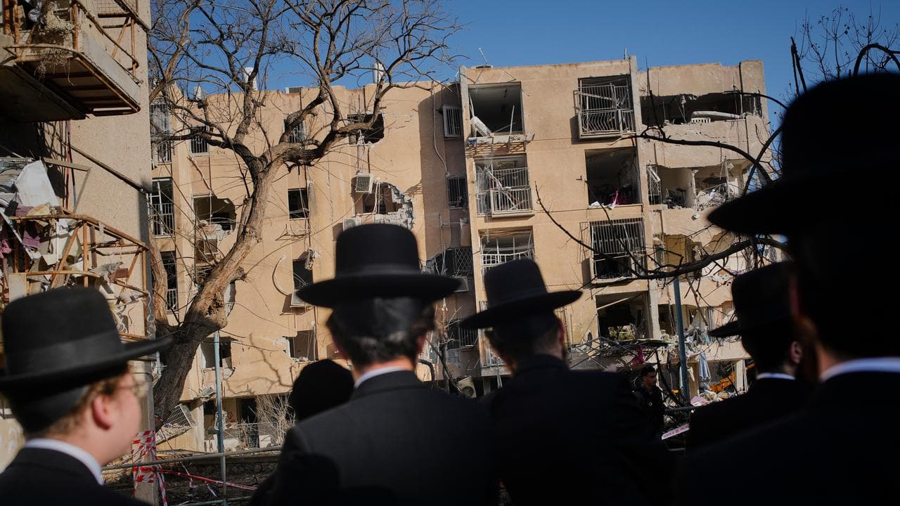 Residential buildings damaged by an Iranian missile strike in Arad