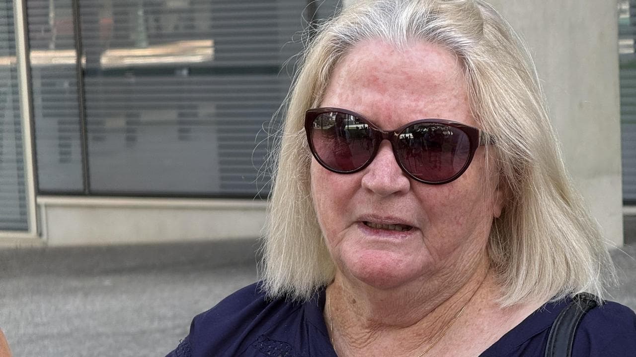 Jill Trestrail holds a photo of her husband Mark 