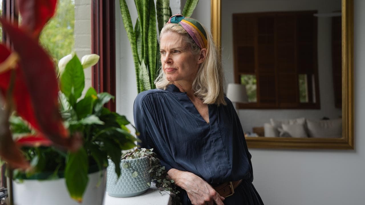 Emm Tinkler looks out window