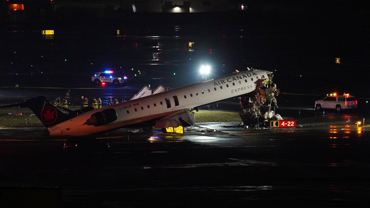 An Air Canada Jet sits on the runway at LaGuardia Airport