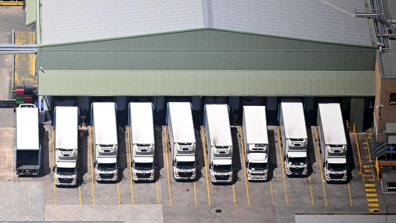 Trucks lined up at a loading dock at a supply depot in western Sydney