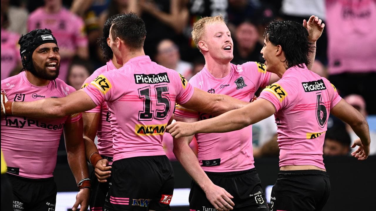 Penrith players celebrate a try.