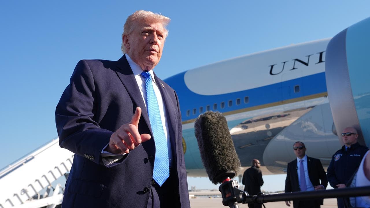 US President Donald Trump speaks before boarding Air Force One