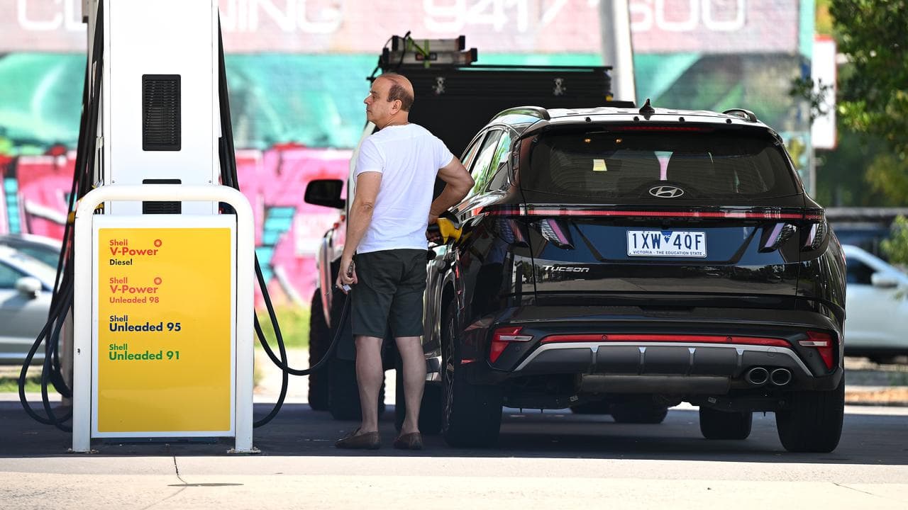 People fill up at a petrol station in Melbourne (file image)