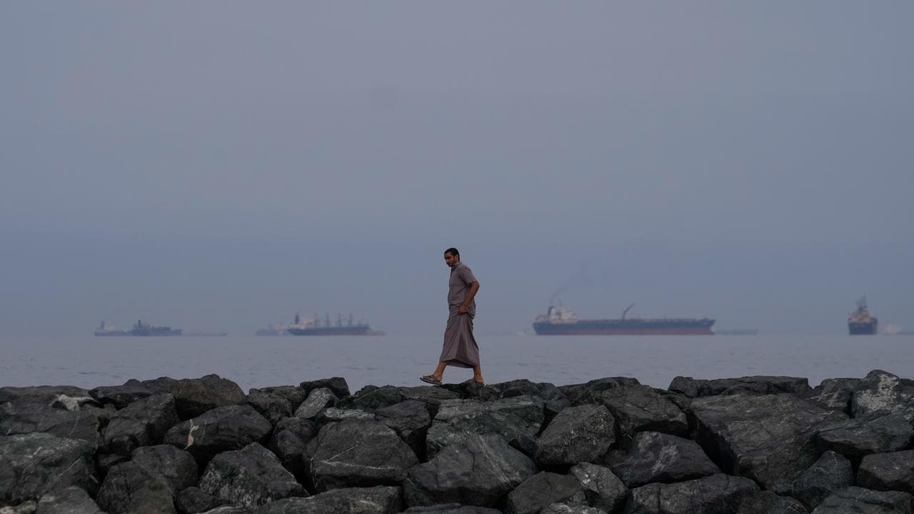 Oil tankers and cargo ships line up in the Strait of Hormuz