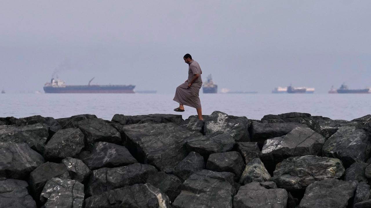 Oil tankers and cargo ships line up in the Strait of Hormuz