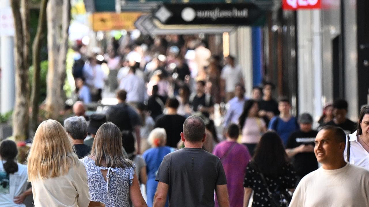 People are seen in the Queen Street Mall in Brisbane