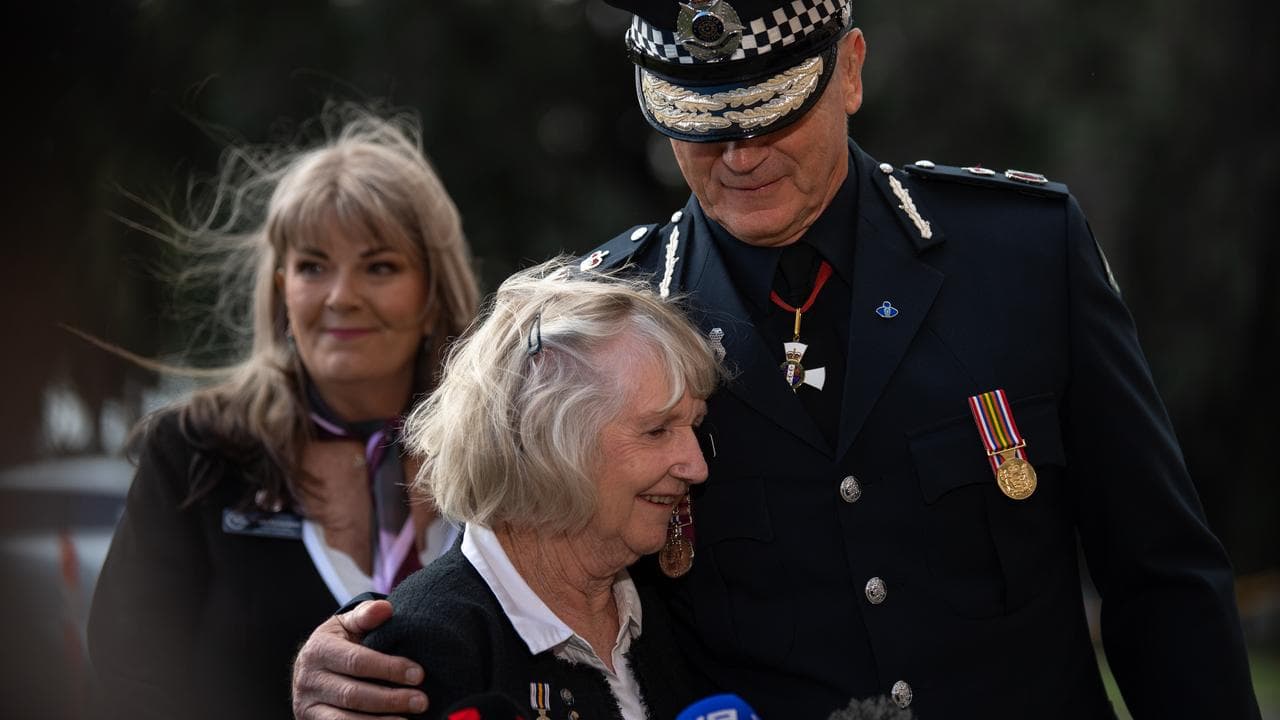Mike Bush embraces Marilyn Taylor,