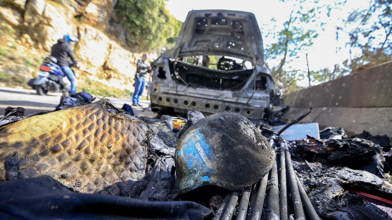 Burnt out car after bombing