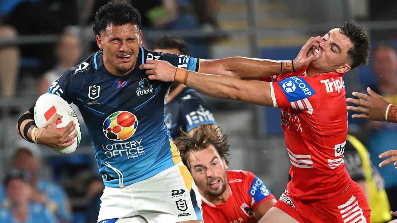 Arama Hau fends off the Dragons' Kyle Flanagan.