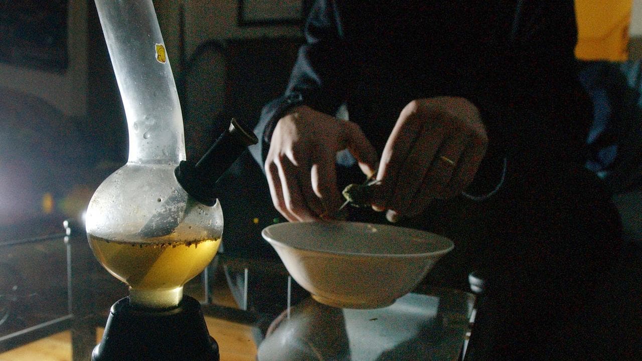 A cannabis user with a bong (file image)