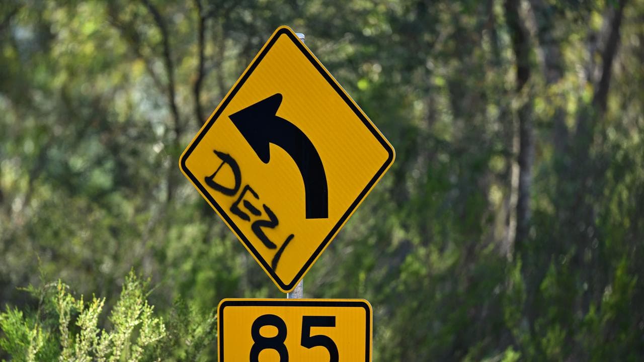 A street sign is seen with ‘Dezi’ spray painted