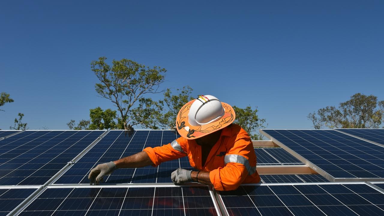 Northern Territory workers install solar panels in Daly River