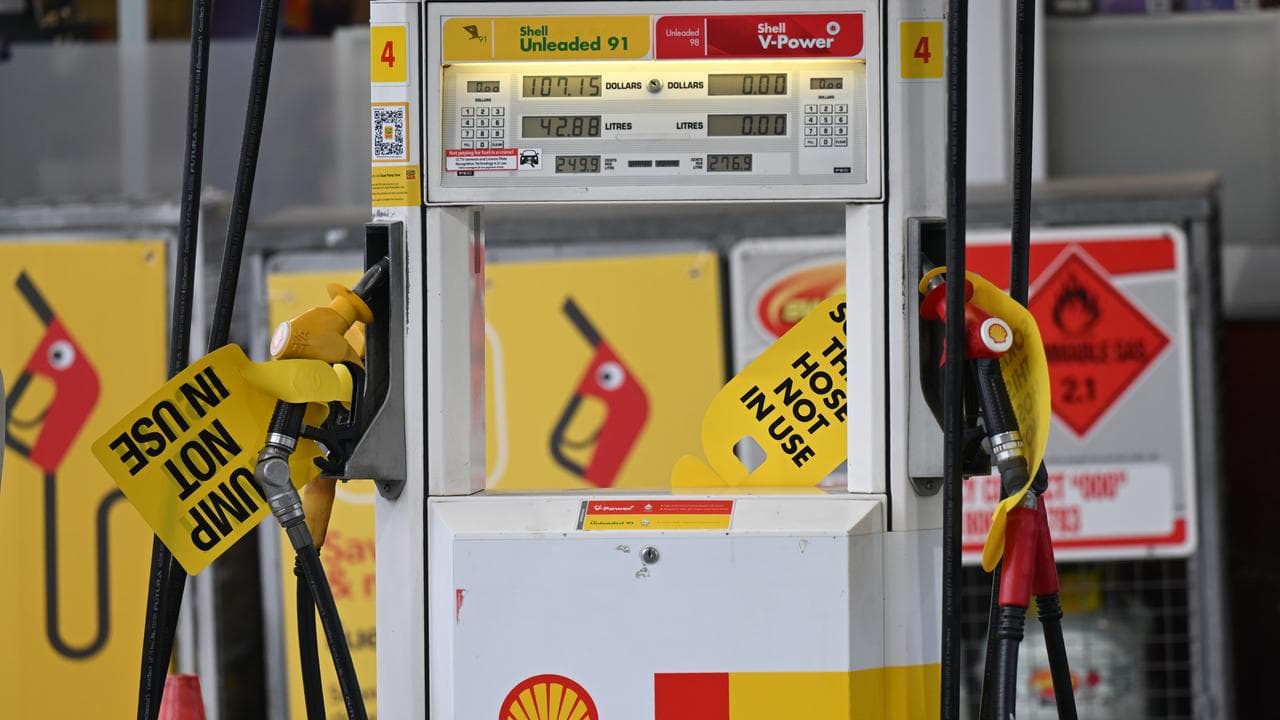 Empty petrol pumps at a petrol station.