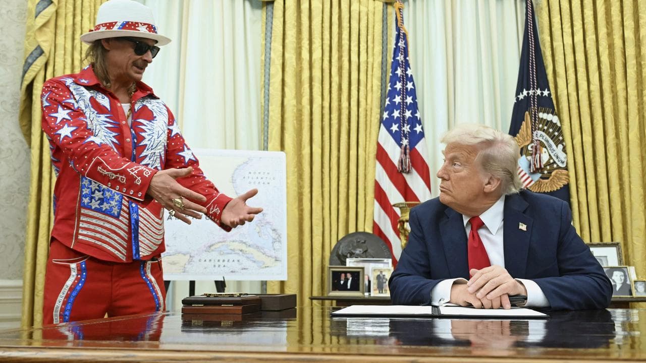 President Donald Trump listens to Kid Rock in the Oval Office