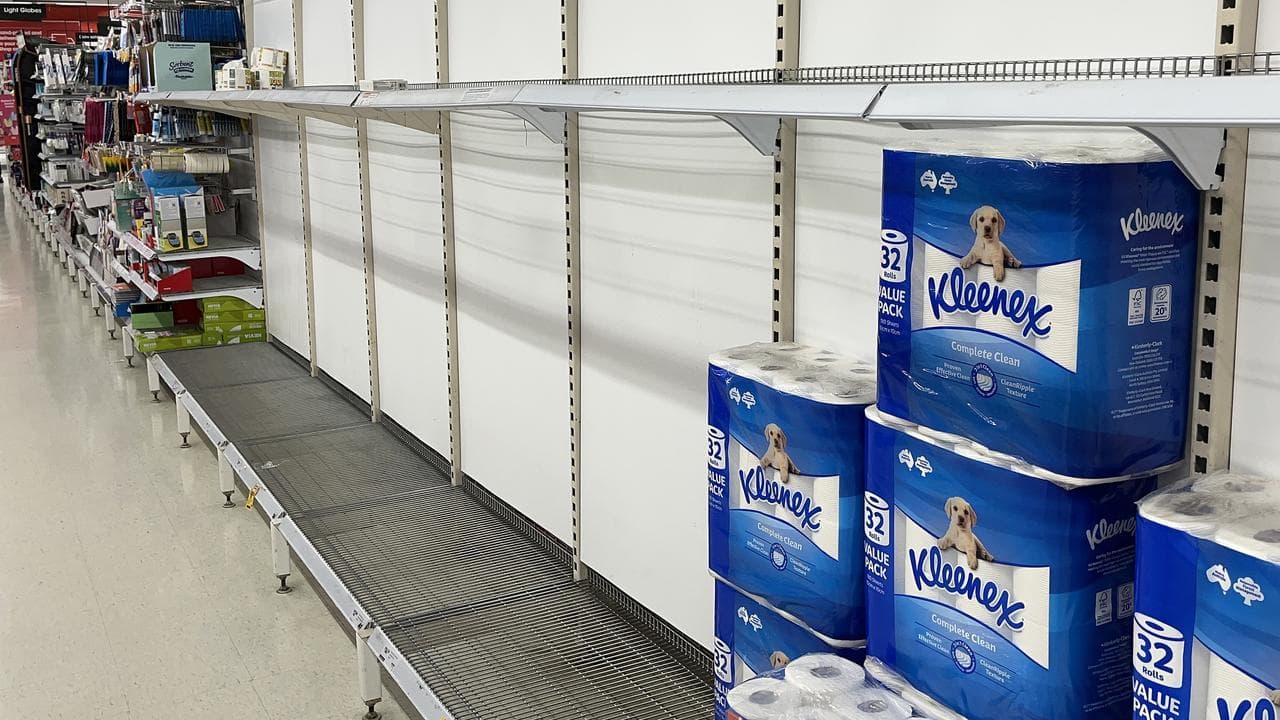 Shelves stripped of toilet paper at Coles supermarket in Darwin.