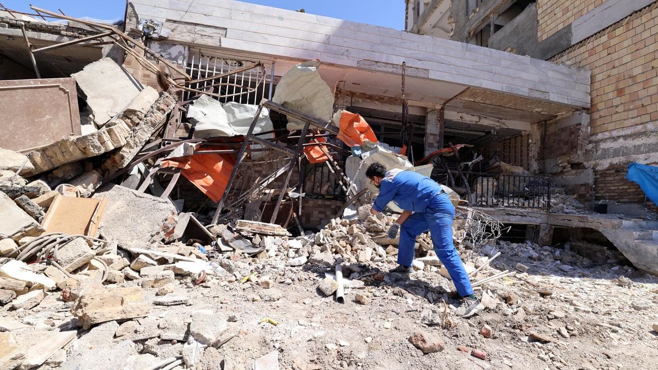 A damaged residential building after an air strike on Karaj, Iran