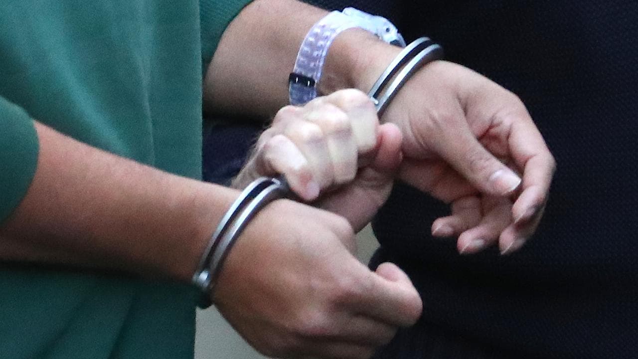 Prisoner in handcuffs (file)
