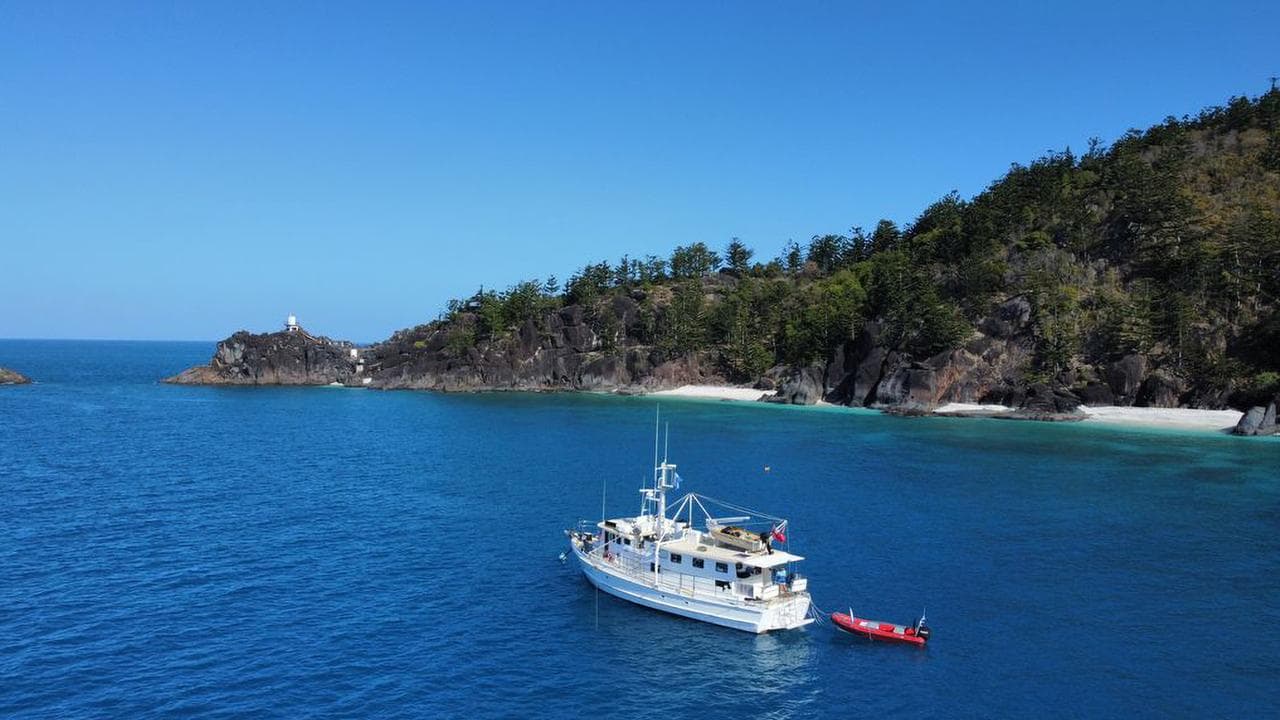 A research vessel sits anchored in the Great Barrier Reef