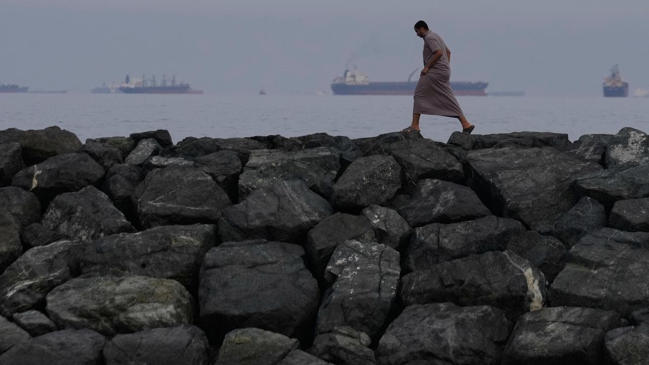 Oil tankers and cargo ships line up in the Strait of Hormuz