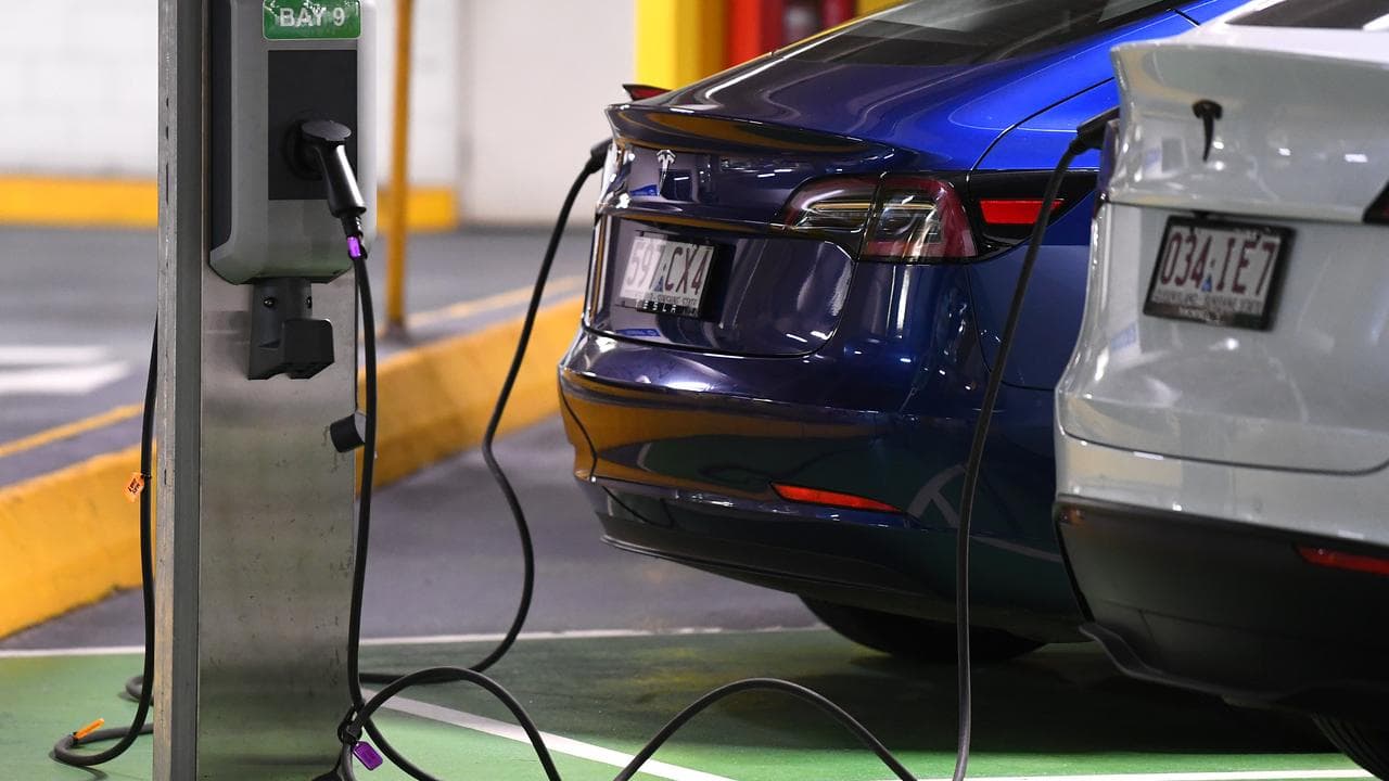 Electric vehicles being charged