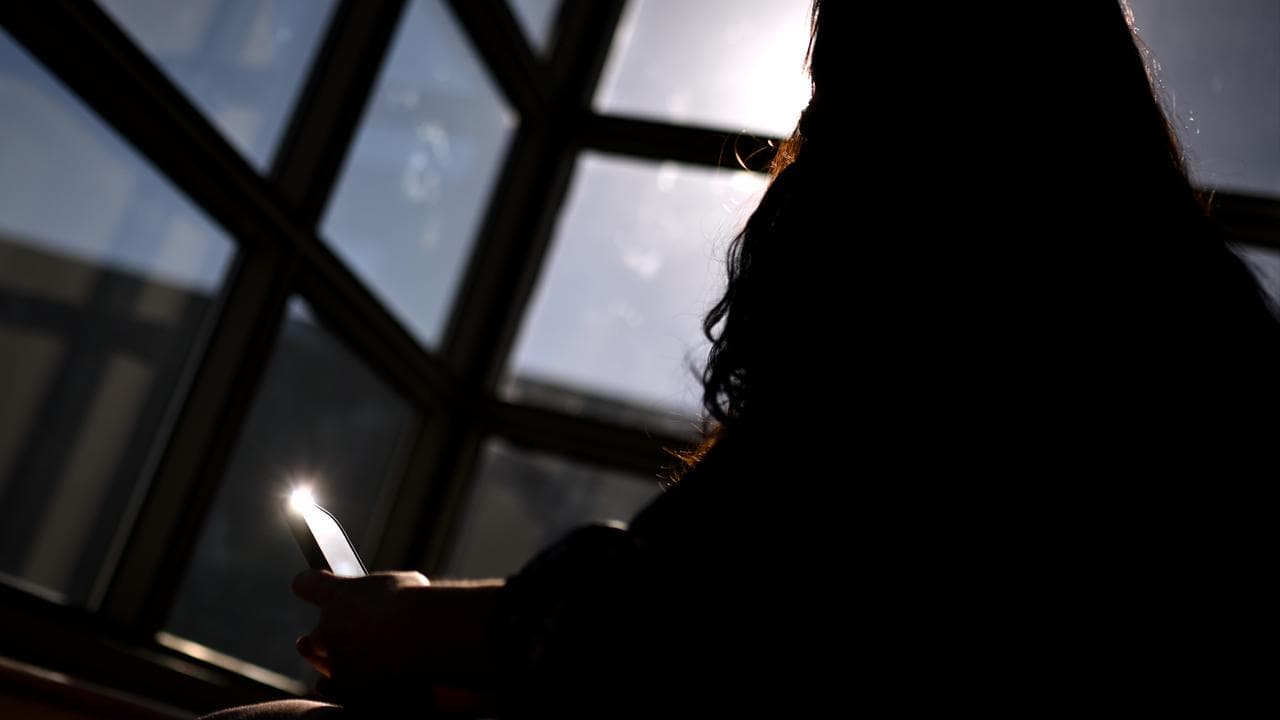 A woman on her mobile phone (file image)