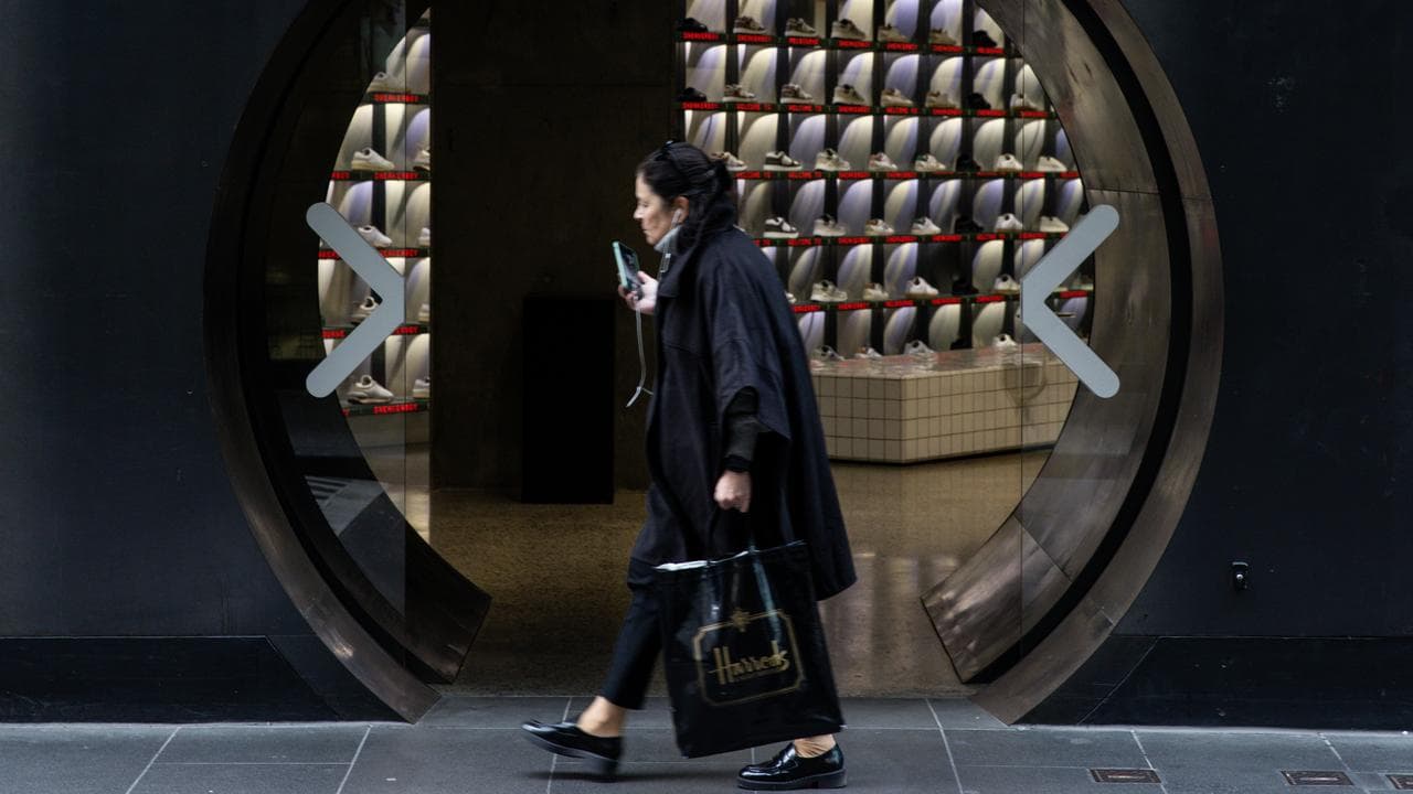 A woman walks past a store (file image)