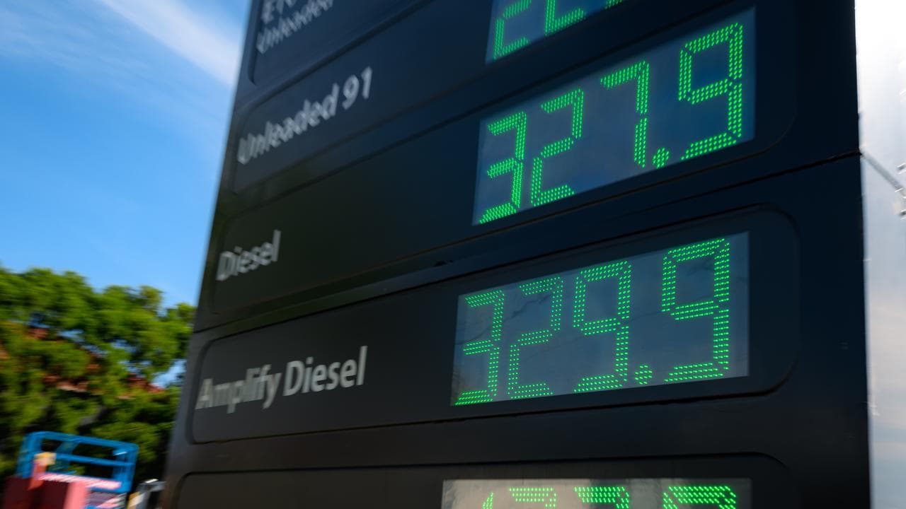 Fuel prices are shown at an Ampol petrol station.