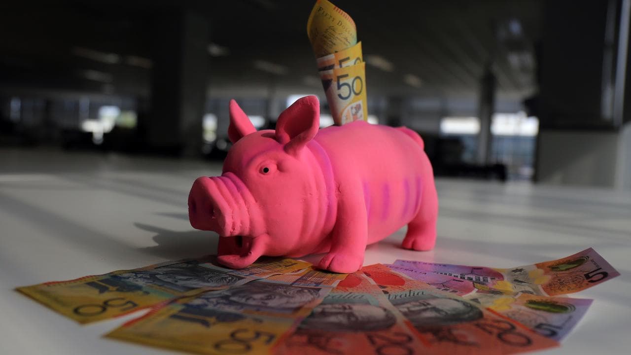 A piggy bank with Australian notes