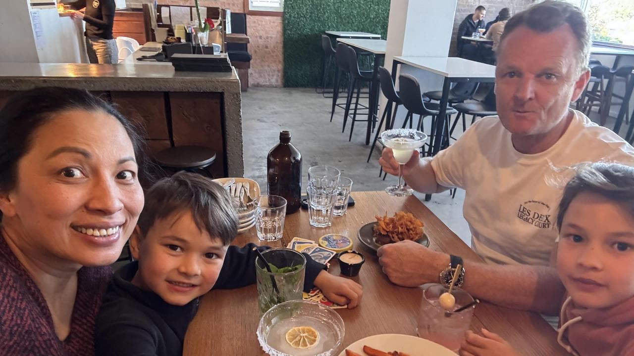 Edward pictured with his family, including mother Natalie Nguyen