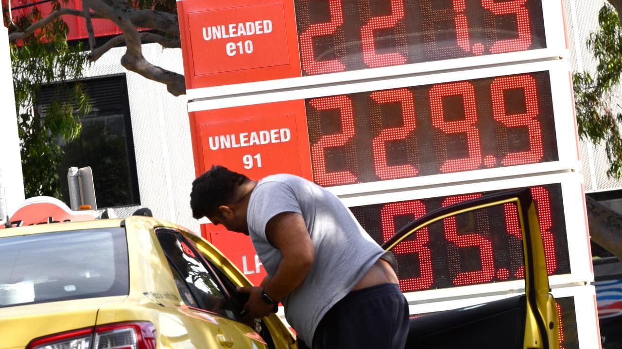 A man fills up at a petrol station