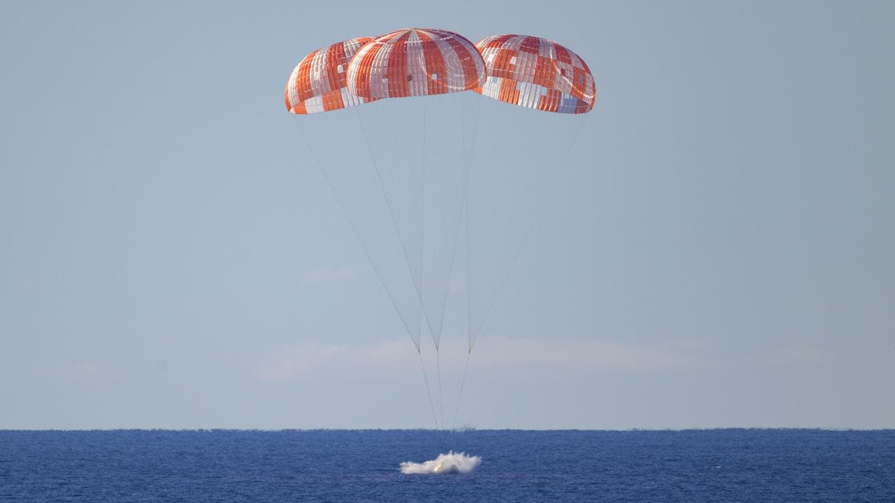 Artemis II capsule hits the ocean