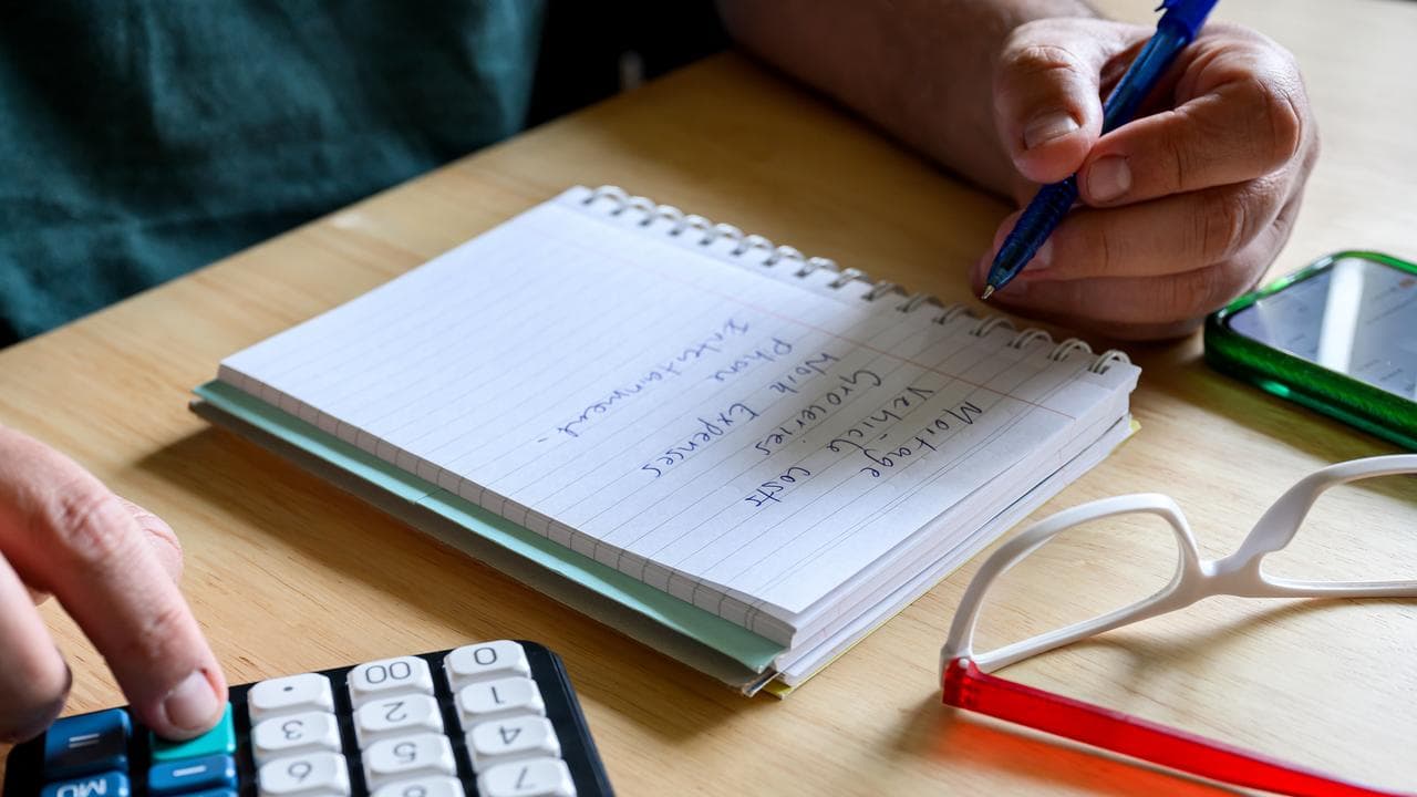 Using a calculator to determine a  household budget