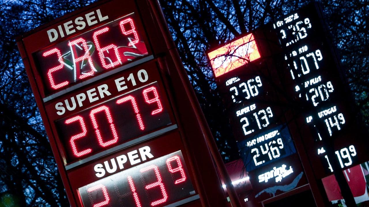 Displays show fuel prices at a petrol station in Berlin, Germany
