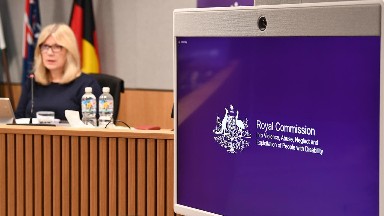 Signage is seen during the Disability Royal Commission in Brisbane
