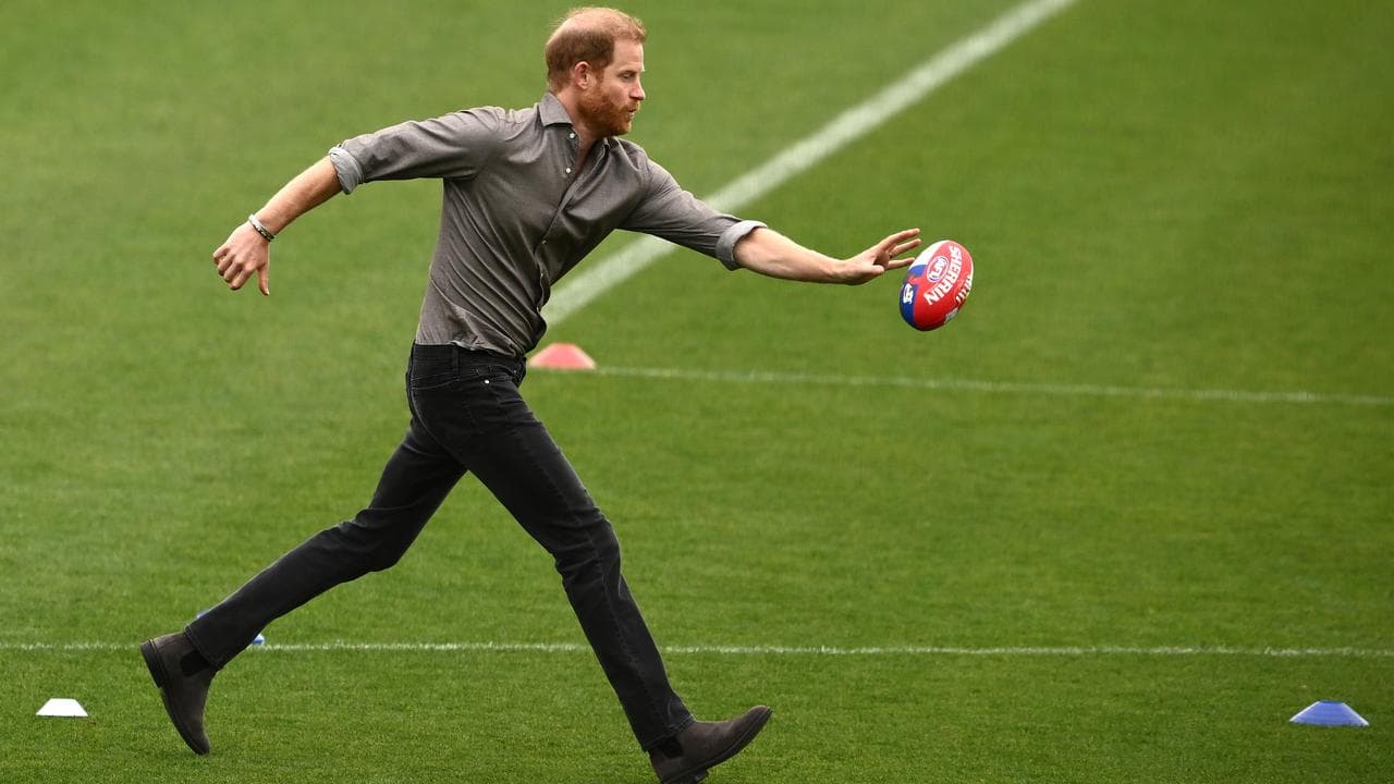 Prince Harry tries his hand at AFL